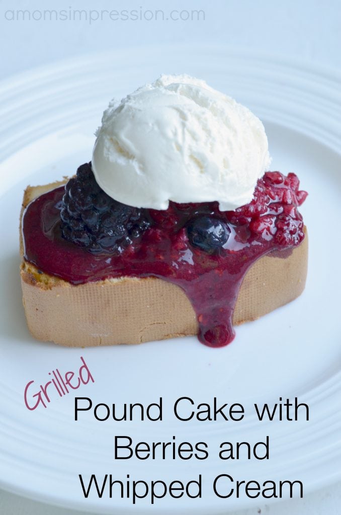 Grilled pound cake with berries and whipped cream sitting on a white plate