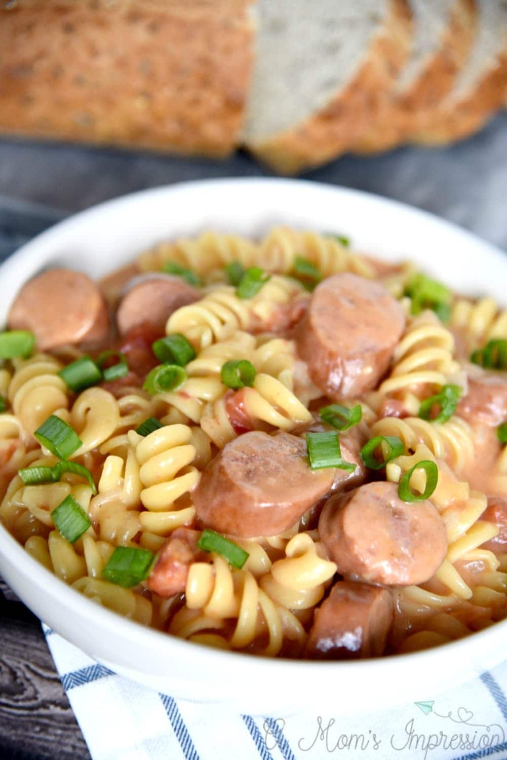 This One Pot cheesy pasta with smoked sausage is easy to make and even easier to clean up. Filled with tomatoes, onion, sausage and cheese, it is sure to become a family favorite recipe. 