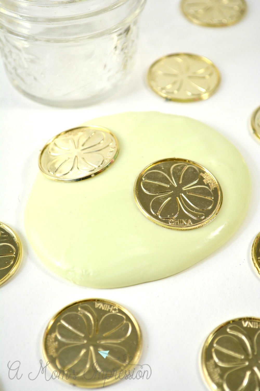 Dish Soap Lime being imprinted with St. Patrick's Day decorations. 