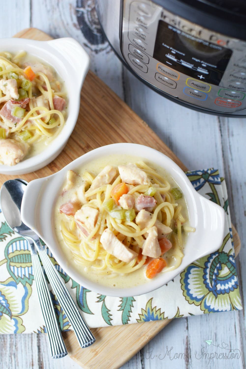 Crack Chicken Noodle Soup sitting next to an Instant Pot