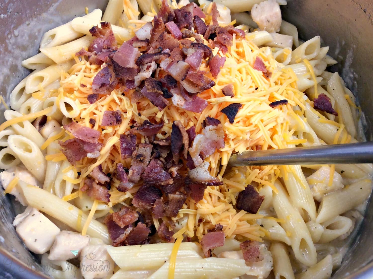 Crispy Bacon and Cheddar Cheese is added to the Crack Chicken Pasta