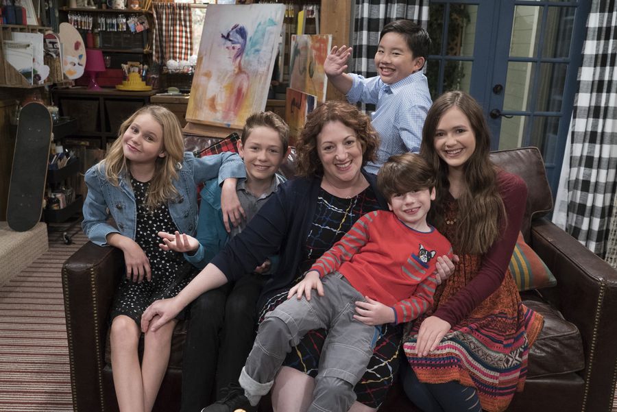 Coop and cami Cast on sofa