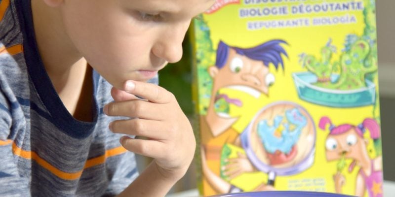 young child doing science experiments