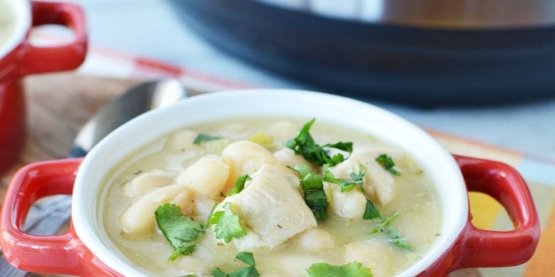 bowl of instant pot white chicken chili on a cuttingboard