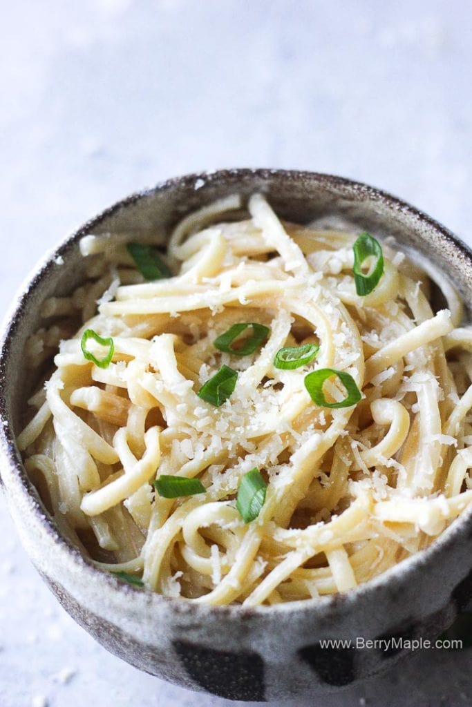 a bowl of instant pot alfredo in a silver bowl