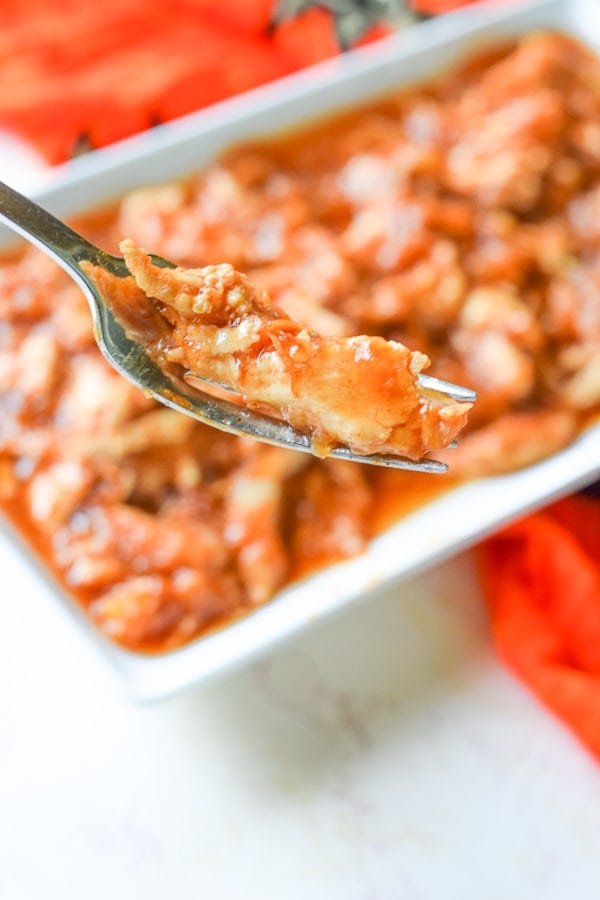 a fork with a bite of instant-pot-hawaiian-chicken on it