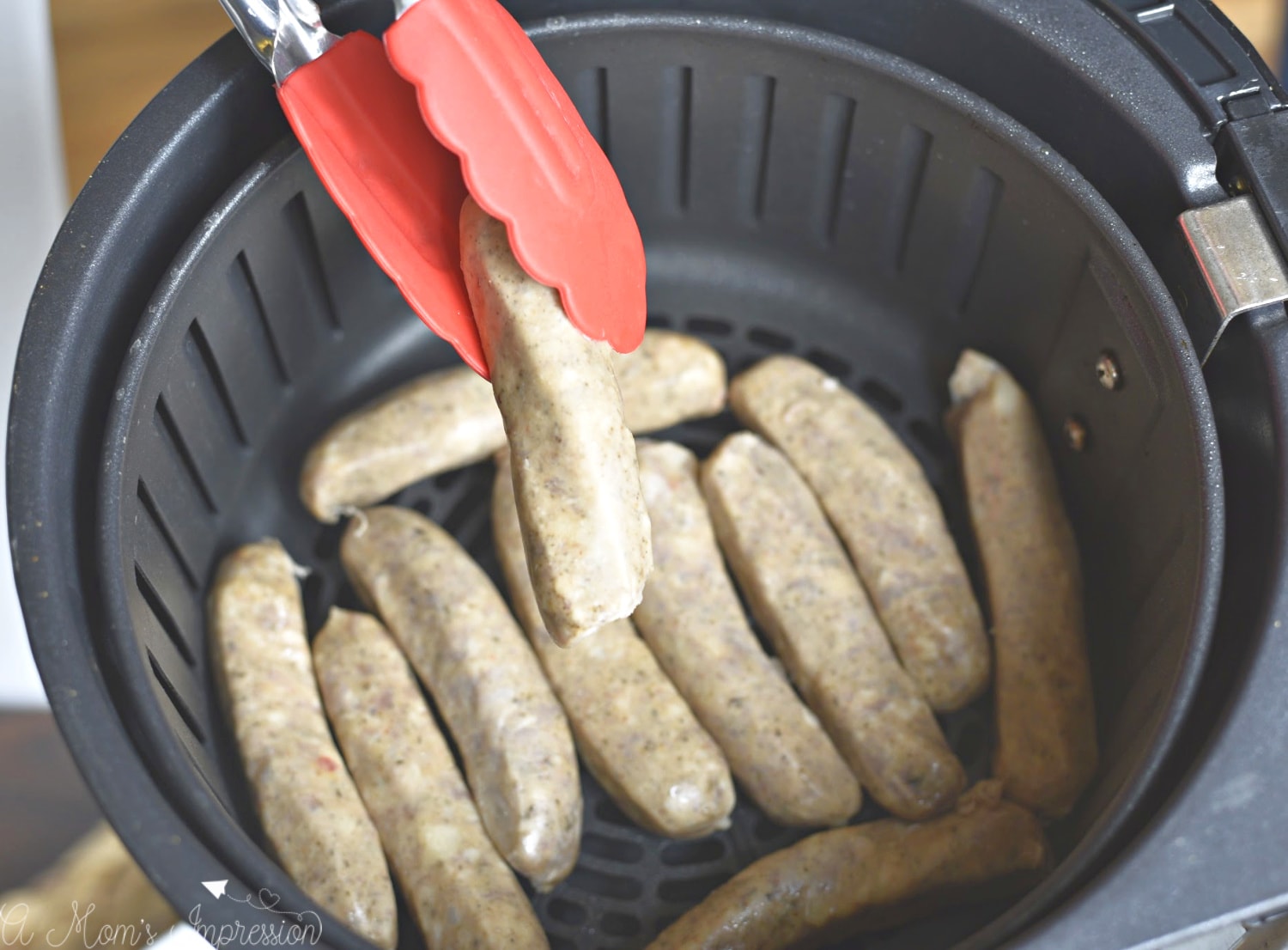 how to cook sausages in an airfyer, taking them out with tongs