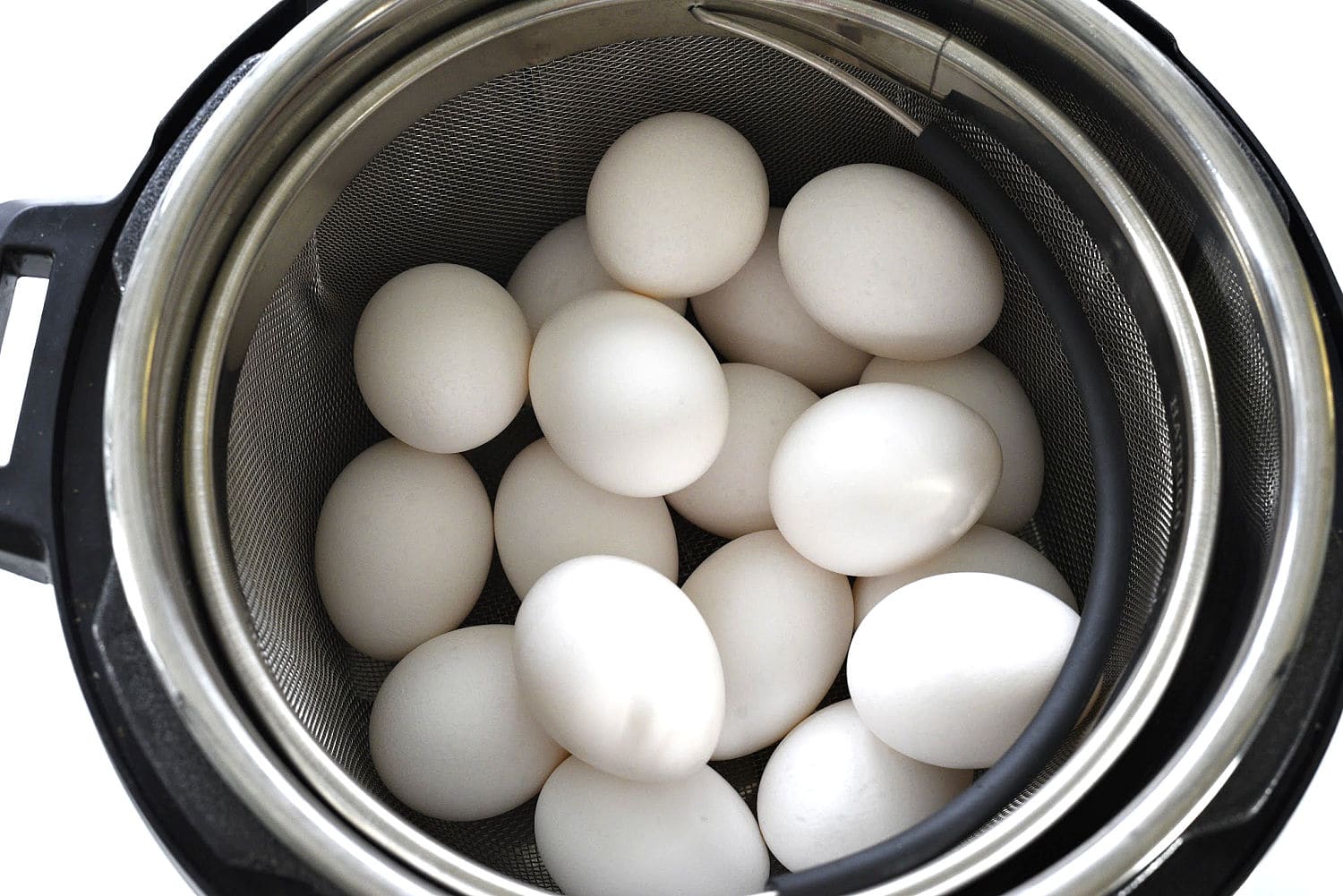 A pressure cooker full of eggs