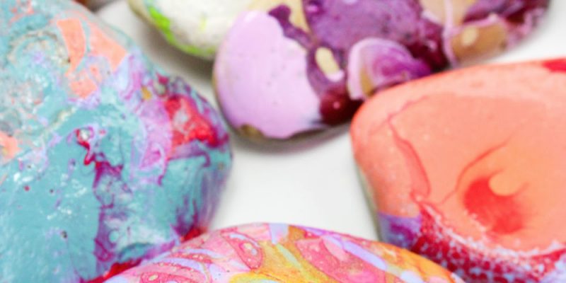 marbled painted rocks on display
