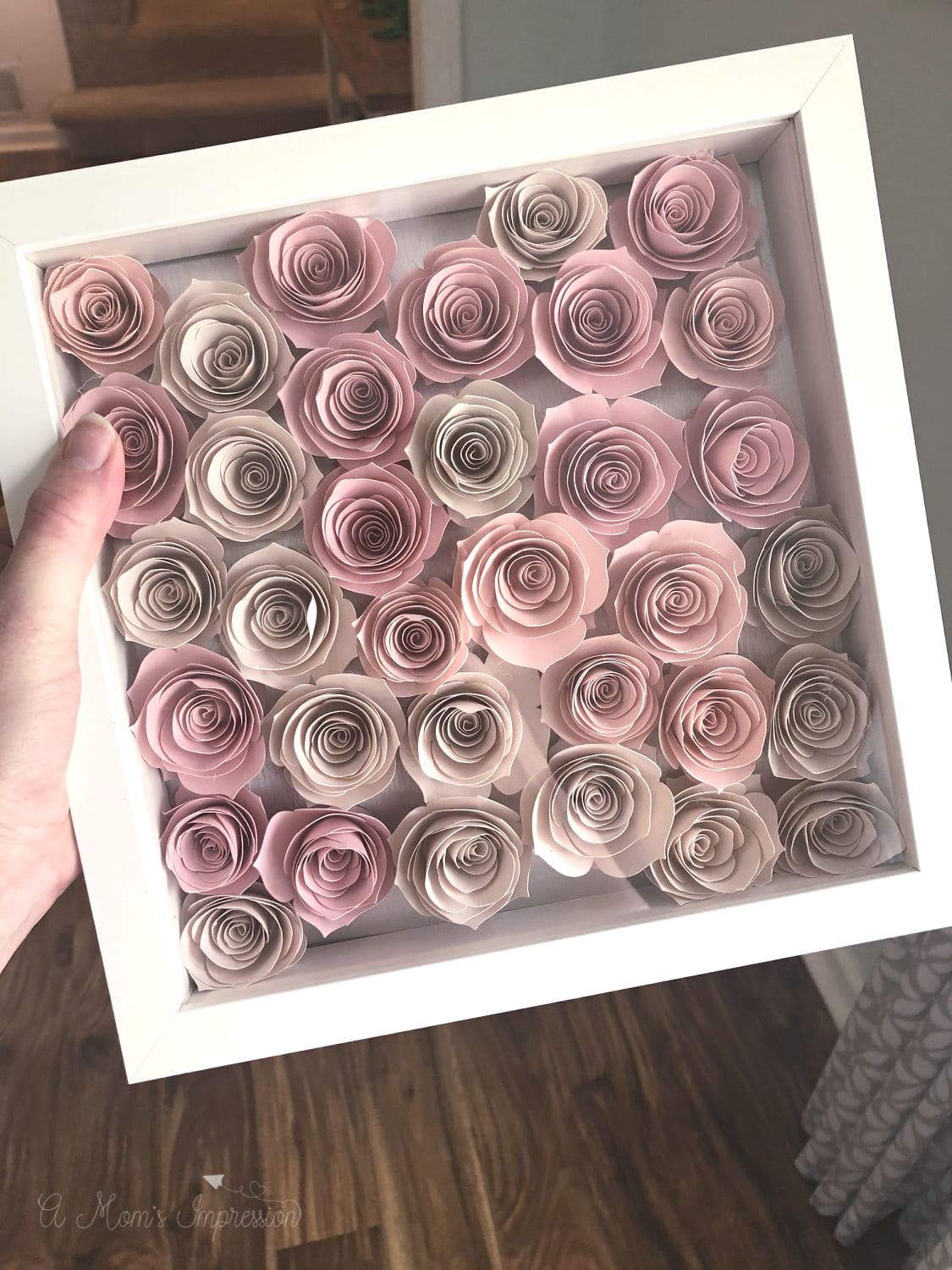 a frame full of paper roses 