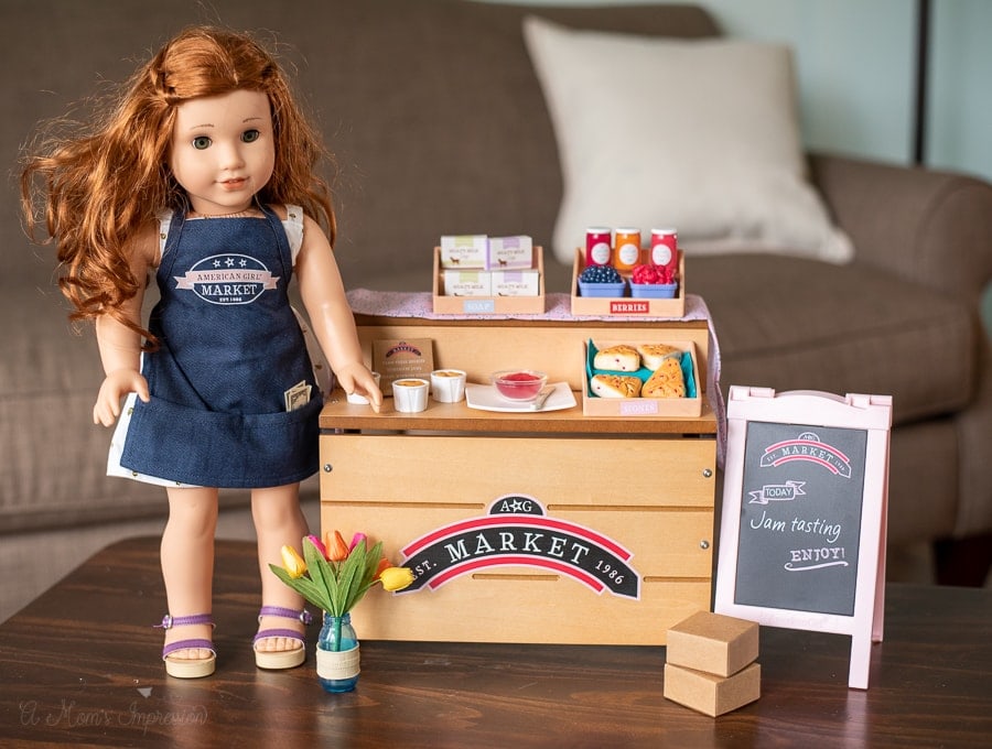 a doll standing by a city market play toy