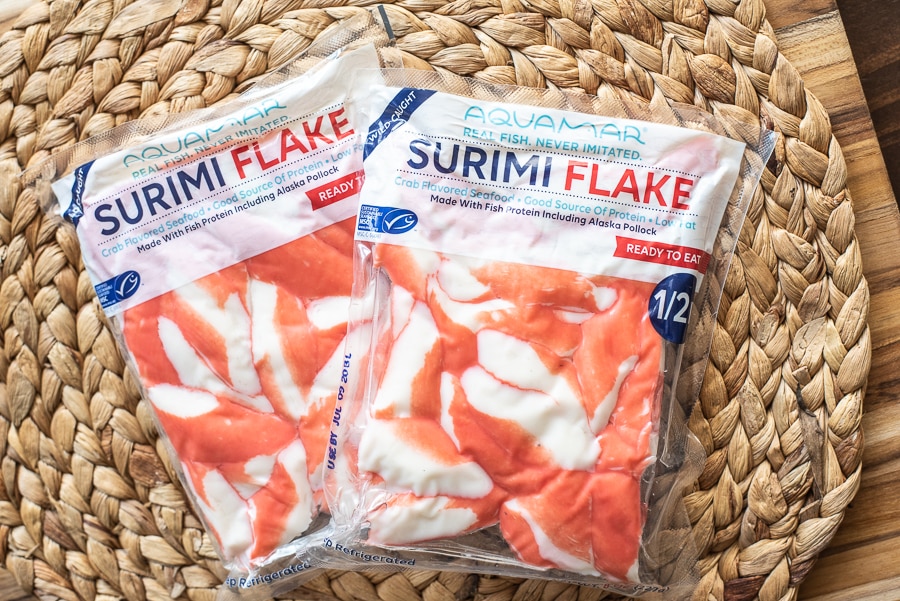 Two packages of Aquamar Surimi Flakes sitting on a table
