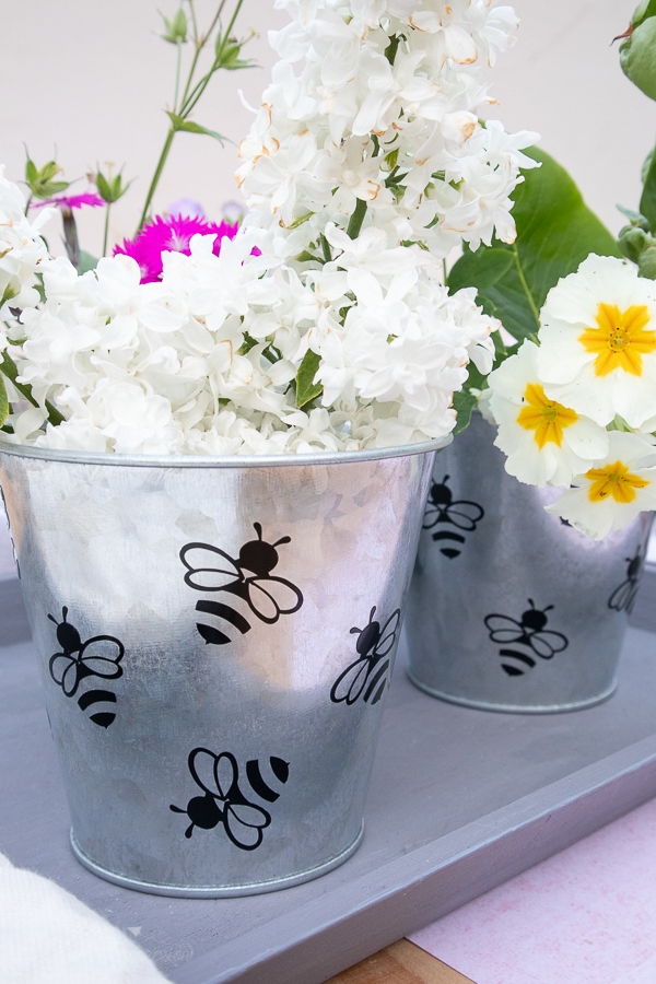 a custom flower pot with bees