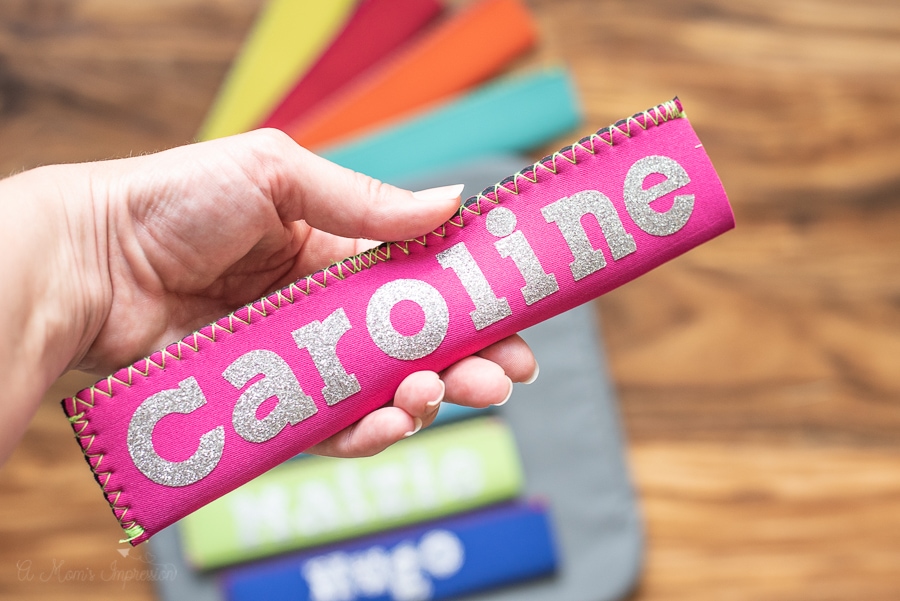 a koozie case with the name caroline printed on it