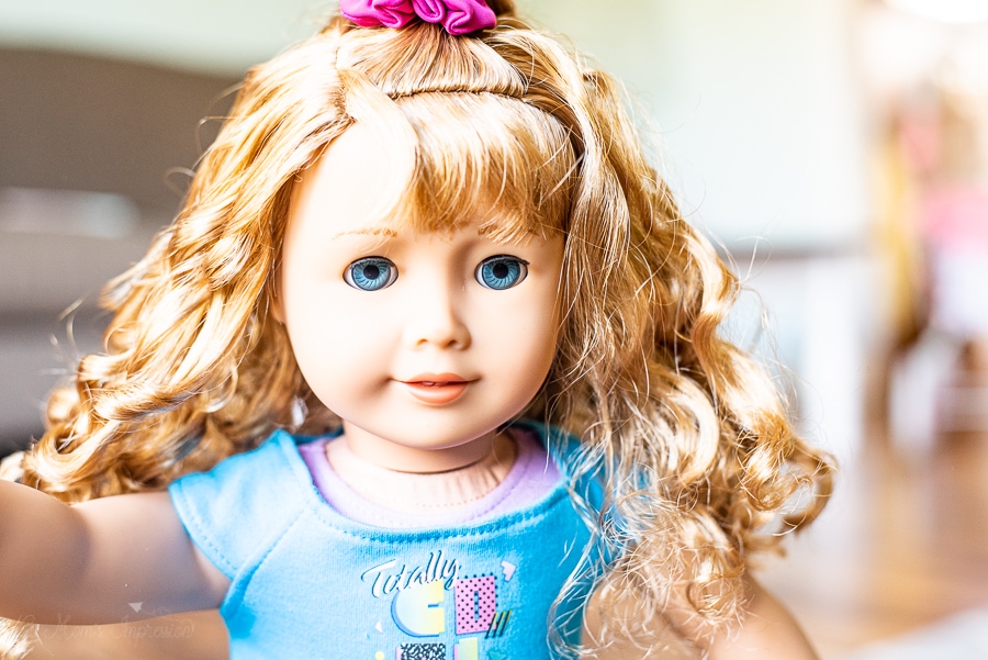 close up of a doll with ringlet hair from the 80s