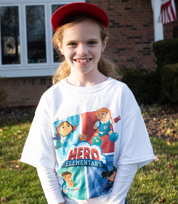 Girl wearing hero elementary shirt