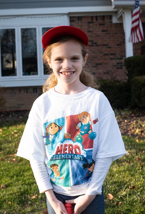 Girl wearing hero elementary shirt 