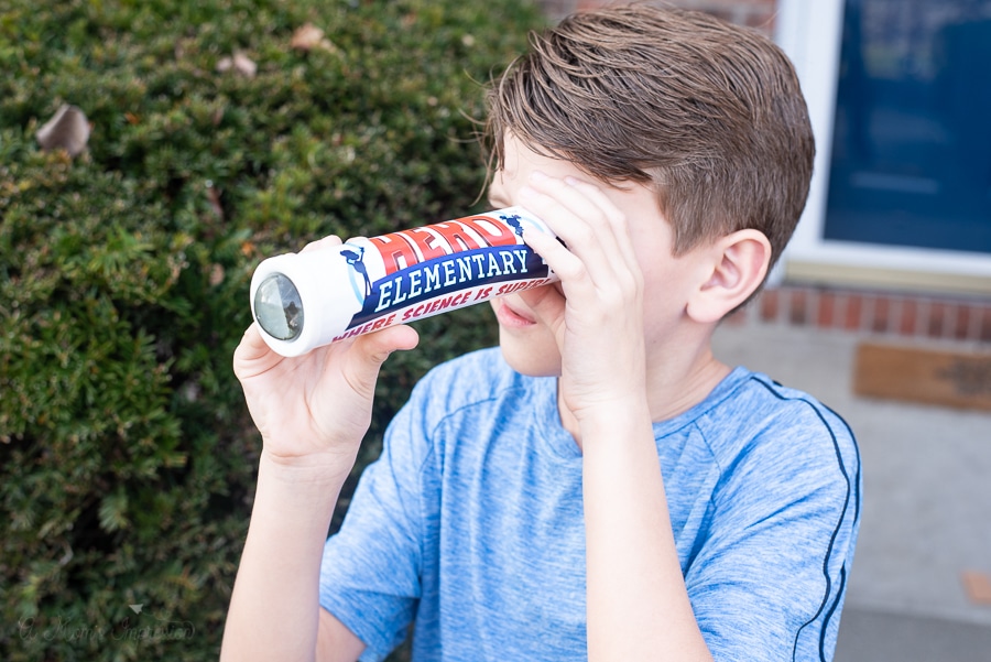 A Boy looking through a kaleidoscope 