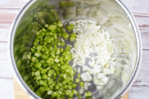 Adding Onion and Celery to Instant Pot.
