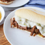 Instant Pot French Dip Sandwich being served on a white plate.