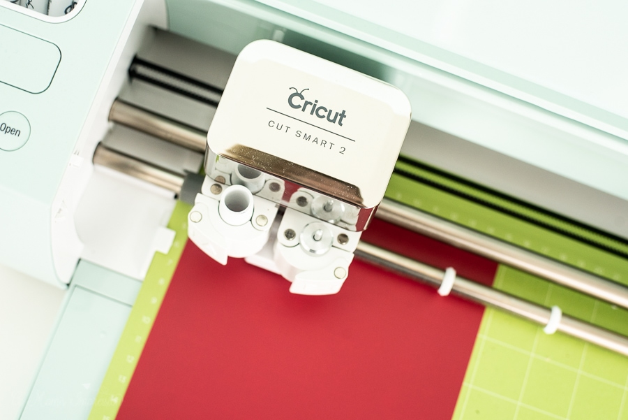 A Cricut cutting maching making a custom dog shirt