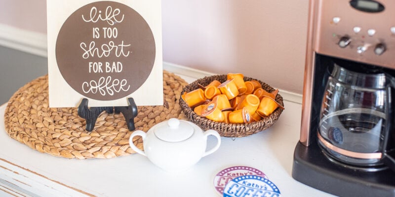 a coffee bar with some creamer and sugar and custom decor