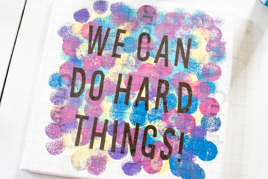 WE can do hard things quote written on a canvas