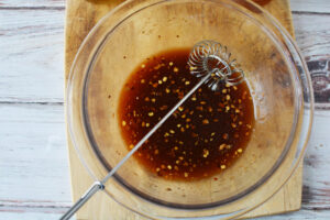 Add vegetable oil, soy sauce, vinegar, honey, brown sugar, tomato paste and red pepper flakes