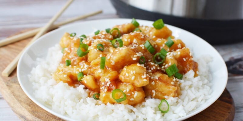 Instant Pot General Tso's Chicken being served over white rice.