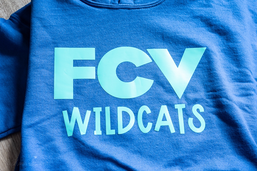 a FCV Wildcat decal on a blue shirt