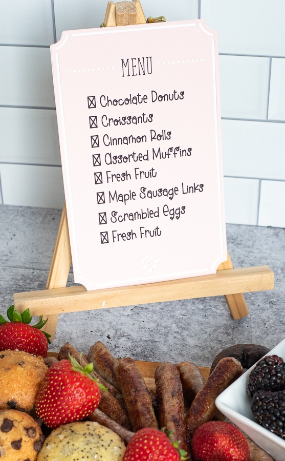 a breakfast menu on a wooden easel