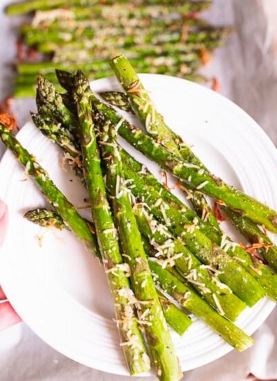 Bundle of asparagus on plate.